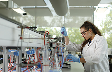 Student in Lab using equipment