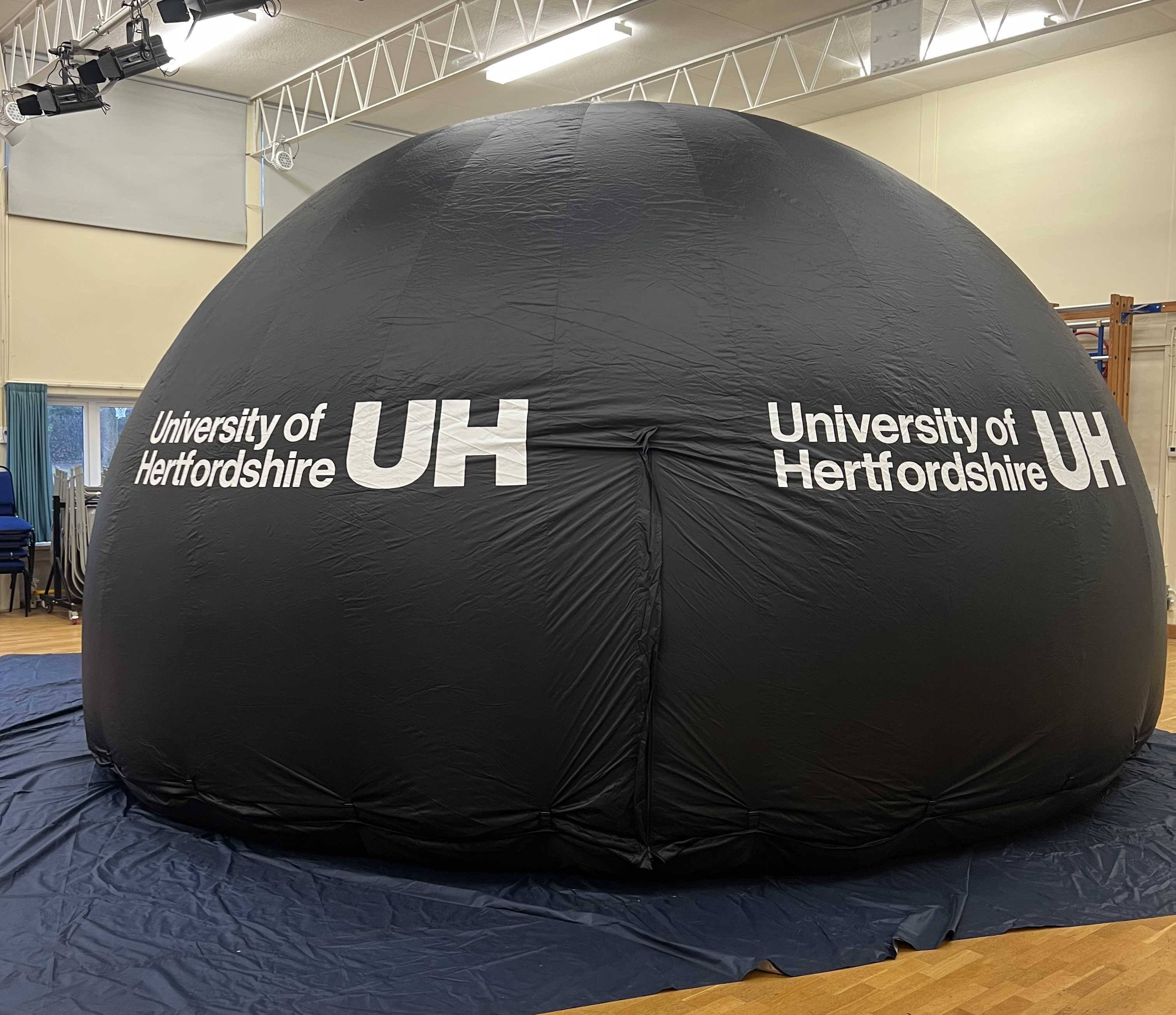 black inflatable dome in a school hall