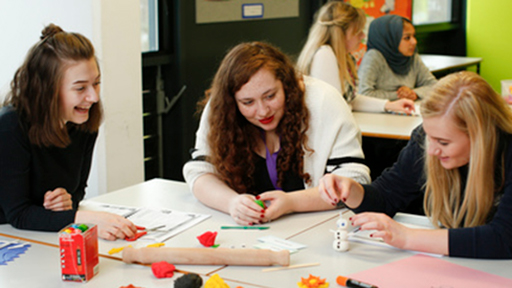 students work in an early years classroom