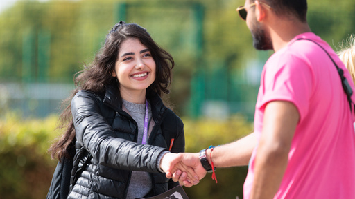 Two people shaking hands in agreement