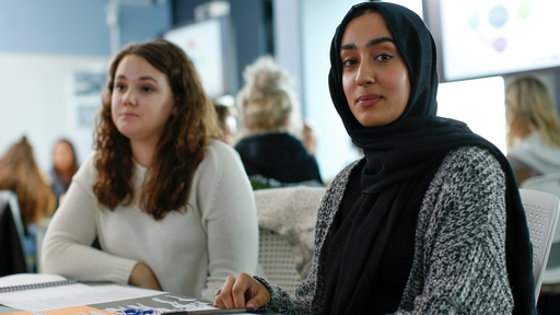 Two students, in class