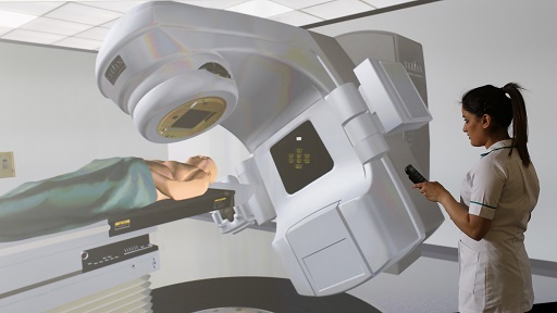 A woman looking at a screen displaying the use of radiographic equipment