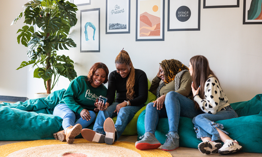 four girls sitting on beanbags